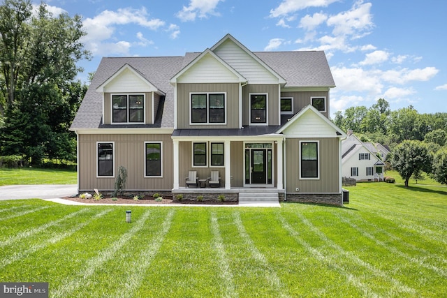 1311 Corbett Rd, Monkton, MD 21111 - view of front of home featuring covered porch, a front yard, and a shingled roof