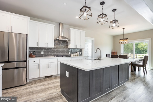 1311 Corbett Rd, Monkton, MD 21111 - kitchen with appliances with stainless steel finishes, wall chimney exhaust hood, white cabinetry, light wood-type flooring, and recessed lighting
