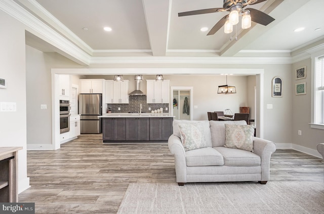 1311 Corbett Rd, Monkton, MD 21111 - living area featuring crown molding, light wood-style flooring, recessed lighting, ceiling fan, and a chandelier