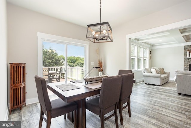 1311 Corbett Rd, Monkton, MD 21111 - dining space featuring a chandelier, plenty of natural light, beam ceiling, light wood-style floors, and coffered ceiling