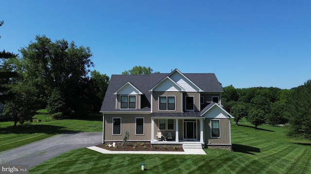 1311 Corbett Rd, Monkton, MD 21111 - traditional-style house with covered porch, a front yard, and driveway