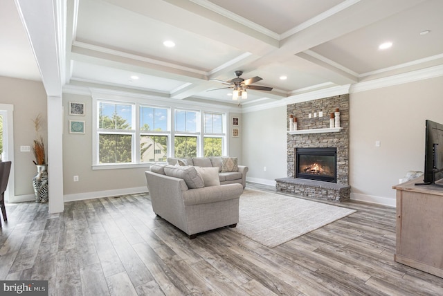 1311 Corbett Rd, Monkton, MD 21111 - living area with ceiling fan, a stone fireplace, beamed ceiling, wood finished floors, and coffered ceiling