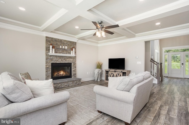 1311 Corbett Rd, Monkton, MD 21111 - living room with wood finished floors, beam ceiling, coffered ceiling, crown molding, and a stone fireplace