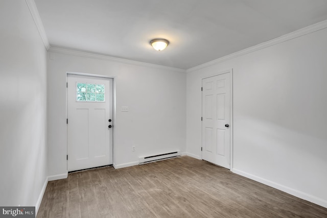 2333 Sunset Cir, Glenville, PA 17329 - entrance foyer featuring a baseboard heating unit, ornamental molding, and wood finished floors