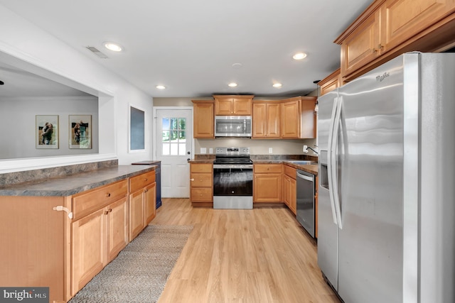 2333 Sunset Cir, Glenville, PA 17329 - kitchen with appliances with stainless steel finishes, light wood-style flooring, dark countertops, and recessed lighting