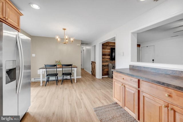 2333 Sunset Cir, Glenville, PA 17329 - kitchen with stainless steel fridge, light brown cabinets, dark countertops, a baseboard heating unit, and a chandelier