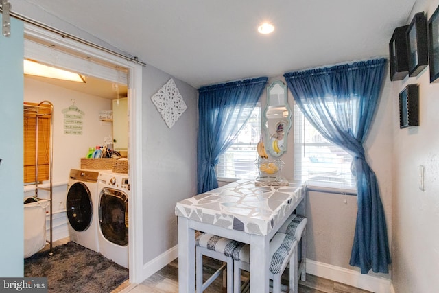 7723 Meath Rd, Baltimore, MD 21222 - washroom featuring washer and dryer and wood finished floors