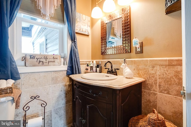 7723 Meath Rd, Baltimore, MD 21222 - bathroom with tile walls, vanity, and wainscoting