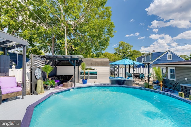 7723 Meath Rd, Baltimore, MD 21222 - view of swimming pool featuring a pergola, outdoor lounge area, an outdoor structure, and a deck