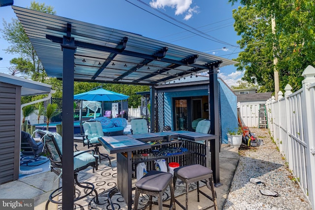 7723 Meath Rd, Baltimore, MD 21222 - fenced backyard featuring a pergola, a patio, outdoor dining area, and an outdoor structure