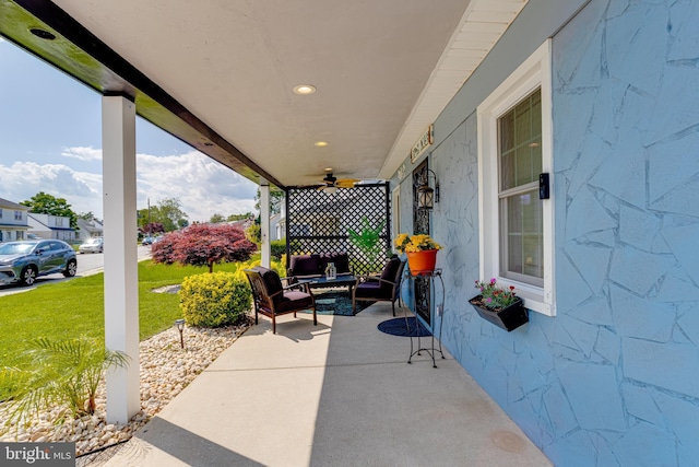 7723 Meath Rd, Baltimore, MD 21222 - covered porch with a lawn, a ceiling fan, and outdoor lounge area