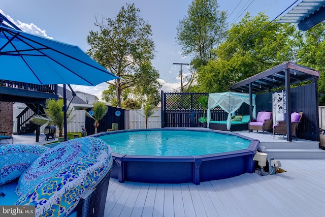 7723 Meath Rd, Baltimore, MD 21222 - view of pool with a fenced backyard, a wooden deck, stairway, and an outdoor hangout area