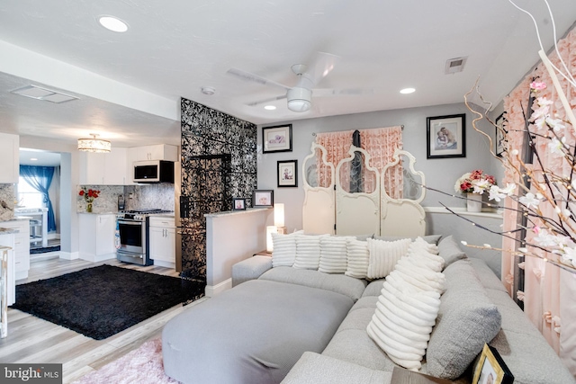 7723 Meath Rd, Baltimore, MD 21222 - living area with light wood-style floors, ceiling fan, and recessed lighting