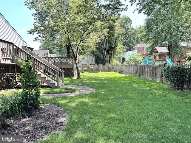 7131 Murray Ln, Annandale, VA 22003 - fenced backyard featuring a playground and stairway