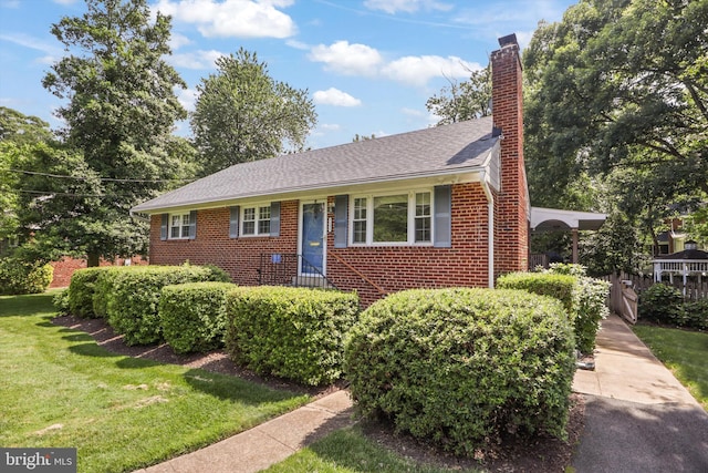 7131 Murray Ln, Annandale, VA 22003 - view of front facade featuring brick siding, a front yard, and a chimney