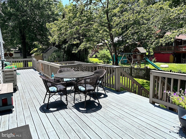 7131 Murray Ln, Annandale, VA 22003 - wooden terrace with outdoor dining space and a playground
