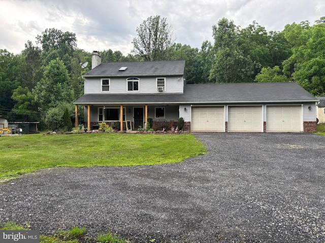 449 Westley Rd, Mohnton, PA 19540 - view of front of home featuring an attached garage, a porch, a front yard, a chimney, and driveway