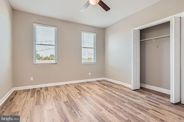 2710 The Alameda, Baltimore, MD 21218 - unfurnished bedroom with multiple windows, light wood finished floors, a closet, and ceiling fan