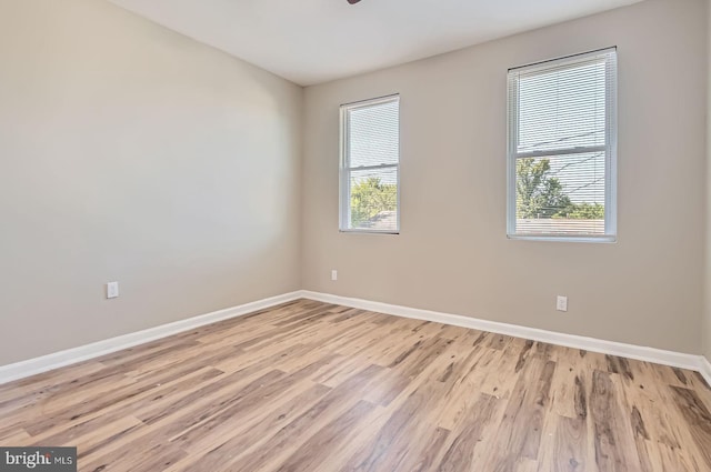 2710 The Alameda, Baltimore, MD 21218 - empty room featuring light wood finished floors, healthy amount of natural light, and a ceiling fan