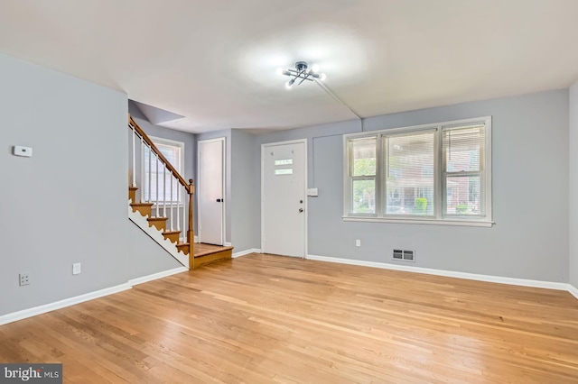 3401 Woodring Ave, Baltimore, MD 21234 - foyer entrance with light wood-type flooring and stairway
