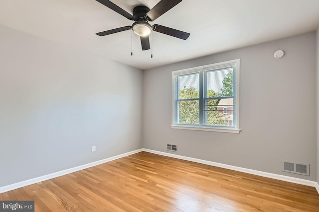3401 Woodring Ave, Baltimore, MD 21234 - unfurnished room featuring light wood-style flooring, a smoke detector, and a ceiling fan