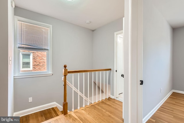 3401 Woodring Ave, Baltimore, MD 21234 - corridor featuring an upstairs landing and wood finished floors