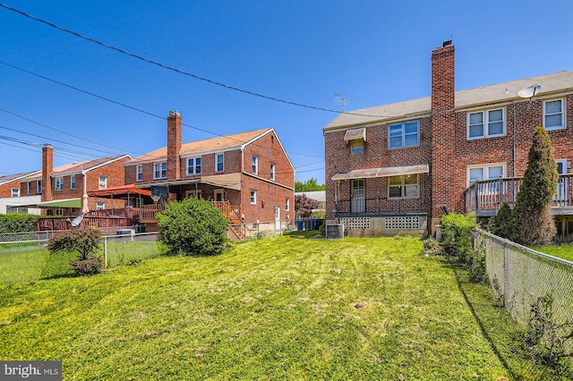 3401 Woodring Ave, Baltimore, MD 21234 - back of property with brick siding, a chimney, and a fenced backyard