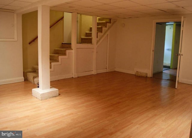 2803 Berwick Ave, Baltimore, MD 21234 - finished basement featuring a paneled ceiling, stairway, and wood finished floors