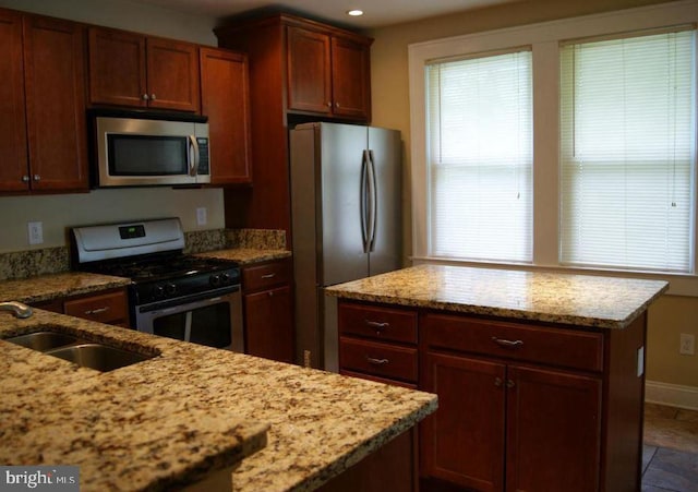 2803 Berwick Ave, Baltimore, MD 21234 - kitchen with stainless steel appliances, plenty of natural light, light stone countertops, recessed lighting, and a kitchen island