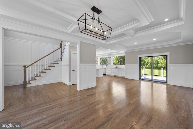387 Gallup Rd, Princeton, NJ 08540 - unfurnished living room featuring a decorative wall, stairs, a chandelier, ornamental molding, and wood finished floors