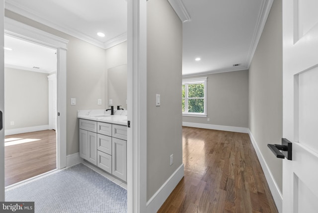 387 Gallup Rd, Princeton, NJ 08540 - bathroom with wood finished floors, crown molding, double vanity, and recessed lighting