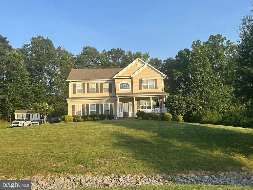39929 Grandview Haven Dr, Mechanicsville, MD 20659 - colonial home featuring covered porch and a front lawn