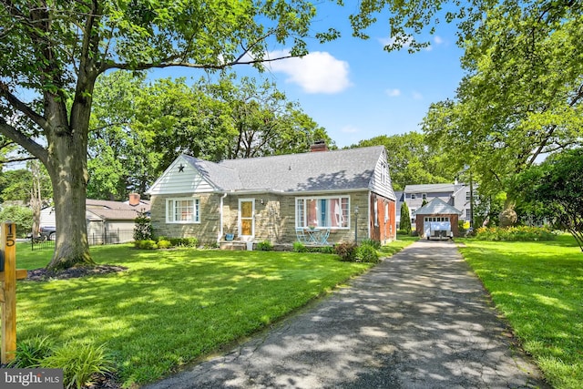 15 Overlook Ave, Lancaster, PA 17601 - view of front of home featuring driveway, a chimney, stone siding, and an outbuilding