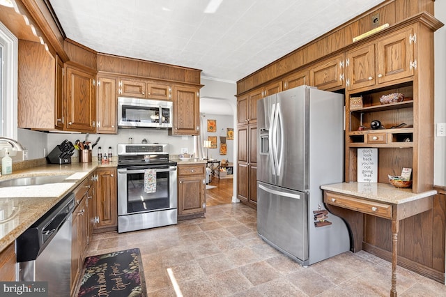15 Overlook Ave, Lancaster, PA 17601 - kitchen with appliances with stainless steel finishes, brown cabinets, light stone countertops, and light stone finish floors