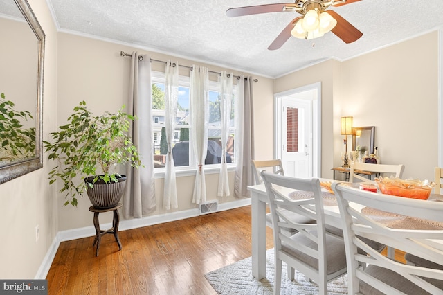 15 Overlook Ave, Lancaster, PA 17601 - dining space with wood finished floors, a ceiling fan, a textured ceiling, and ornamental molding