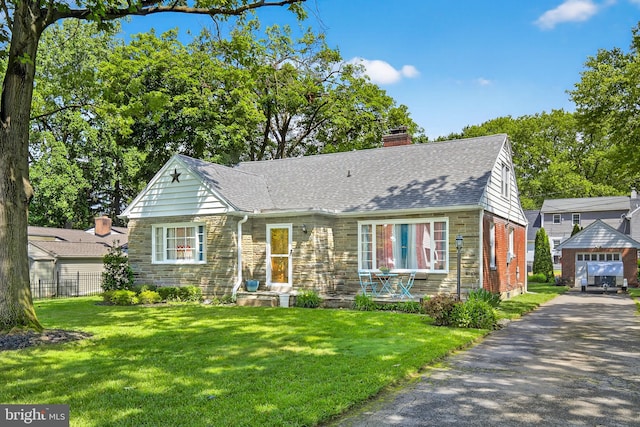 15 Overlook Ave, Lancaster, PA 17601 - view of front of house featuring roof with shingles, a chimney, and stone siding