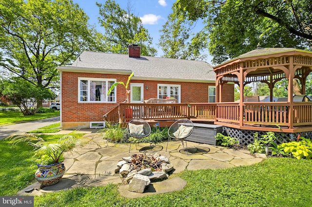 15 Overlook Ave, Lancaster, PA 17601 - back of property with brick siding, a gazebo, a wooden deck, a chimney, and a patio