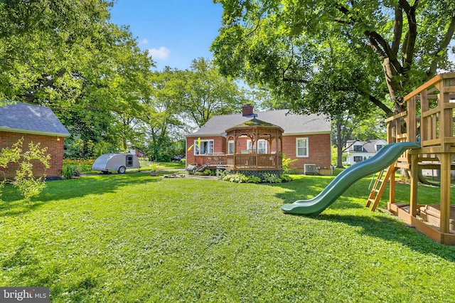 15 Overlook Ave, Lancaster, PA 17601 - rear view of property with a playground, brick siding, a yard, and a wooden deck