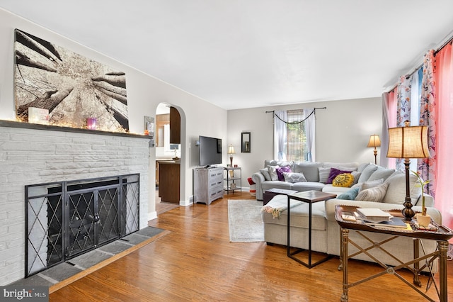 15 Overlook Ave, Lancaster, PA 17601 - living room with wood finished floors, arched walkways, and a fireplace