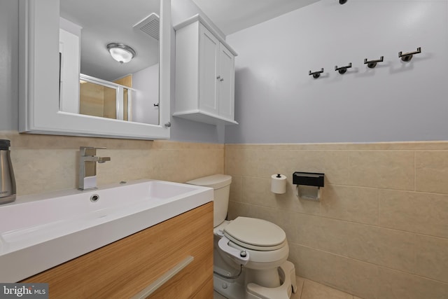 7 Rockford Rd Unit F1, Wilmington, DE 19806 - full bath with vanity, a stall shower, tile walls, and a wainscoted wall