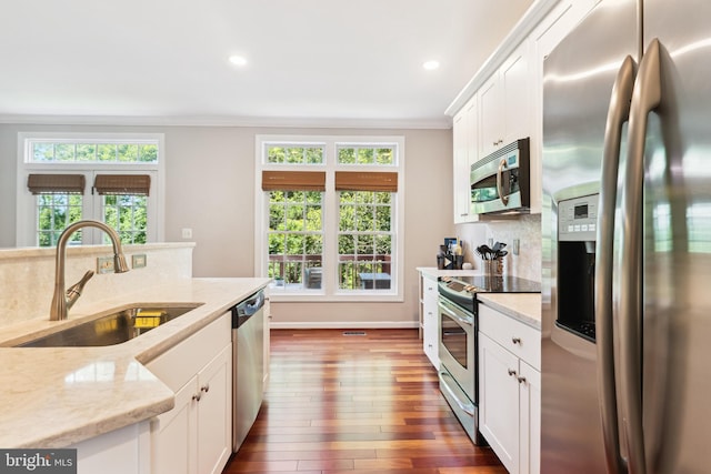 6706 Debra Lu Way, Springfield, VA 22150 - kitchen featuring stainless steel appliances, crown molding, dark wood-style flooring, white cabinets, and light stone counters