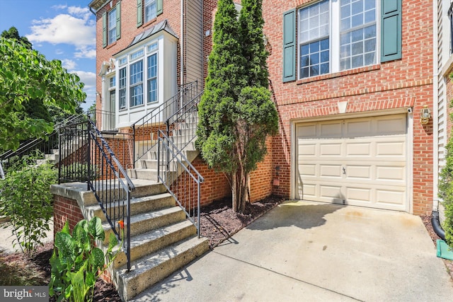 6706 Debra Lu Way, Springfield, VA 22150 - entrance to property with concrete driveway, brick siding, and an attached garage