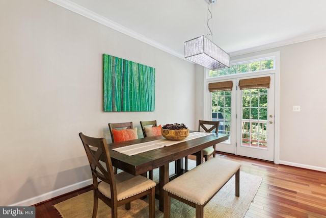 6706 Debra Lu Way, Springfield, VA 22150 - dining space featuring ornamental molding, a chandelier, and hardwood / wood-style flooring