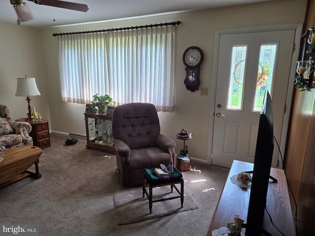 1220 Manatawny St, Pottstown, PA 19464 - living room with carpet floors, plenty of natural light, and a ceiling fan