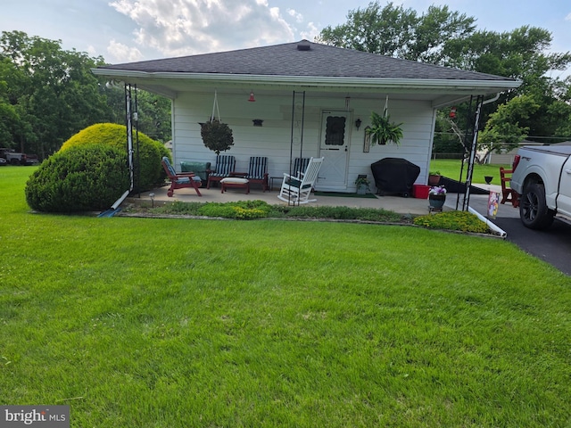 1220 Manatawny St, Pottstown, PA 19464 - back of house featuring a yard, a porch, and roof with shingles