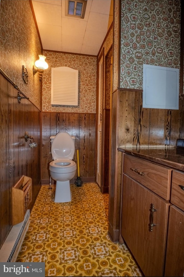 102 Spring St, Bridgeton, NJ 08302 - bathroom with wainscoting, wallpapered walls, tile patterned floors, and wood walls