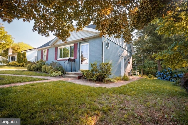 102 Spring St, Bridgeton, NJ 08302 - view of front of home with a front yard, a garage, and brick siding
