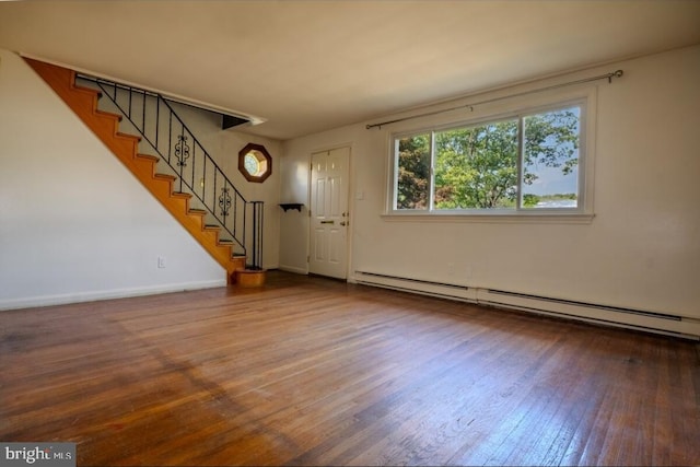 102 Spring St, Bridgeton, NJ 08302 - foyer entrance with a baseboard radiator, wood-type flooring, and stairway