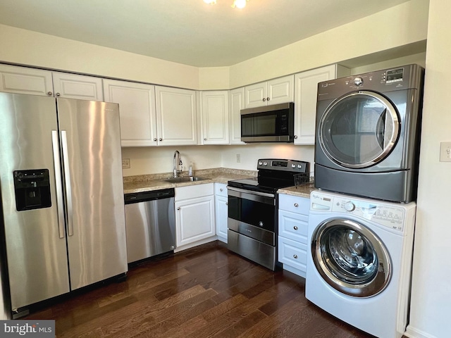 8305 Sunnyside Ct, Manassas Park, VA 20111 - washroom with stacked washer / dryer and dark wood-style floors