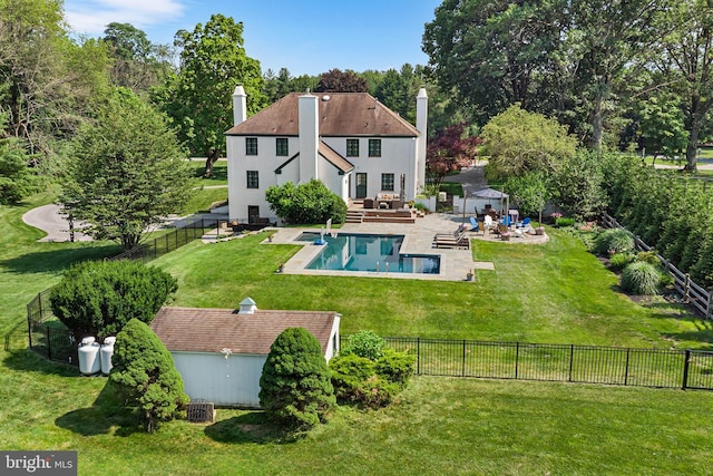 1263 Argyle Rd, Berwyn, PA 19312 - back of property featuring a fenced backyard, a chimney, a patio area, and outdoor lounge area